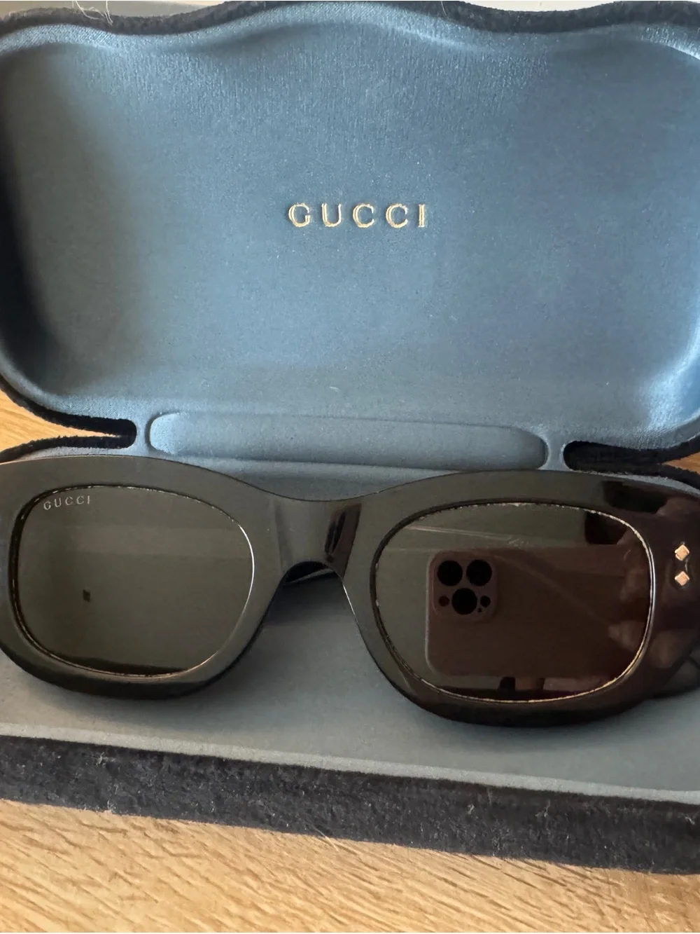 Gucci Glossy Black Oval Sunglasses with Dark Lenses